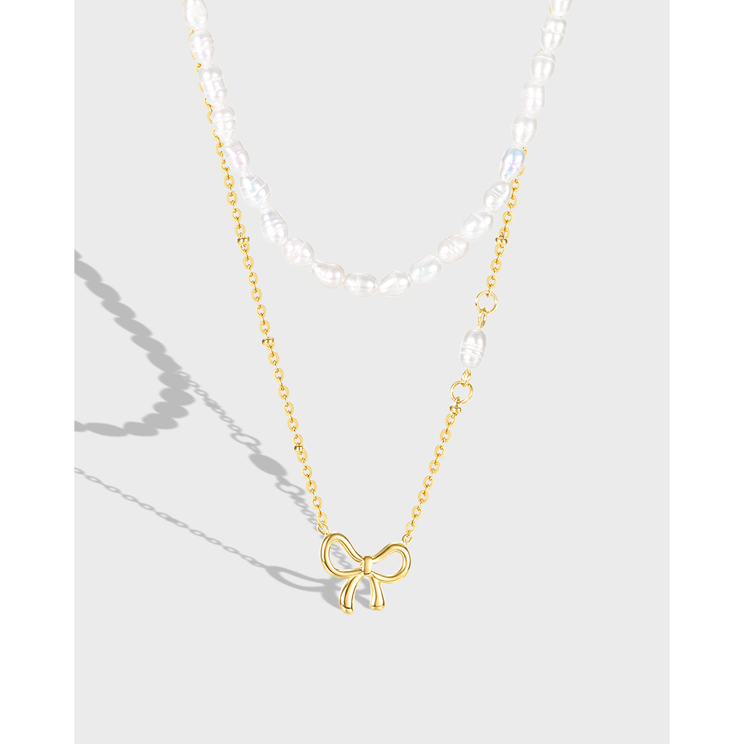 潮牌新品日韩镂空蝴蝶结珍珠质感钛钢项链ins小众设计珍珠锁骨链